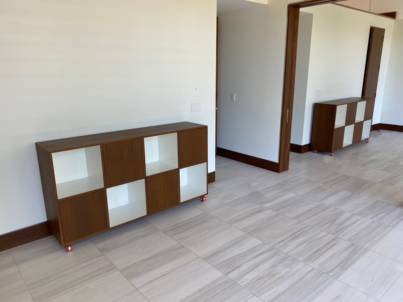 Walnut floating console cabinet in hallway