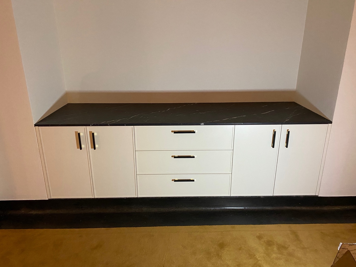 Built-in credenza with black countertop