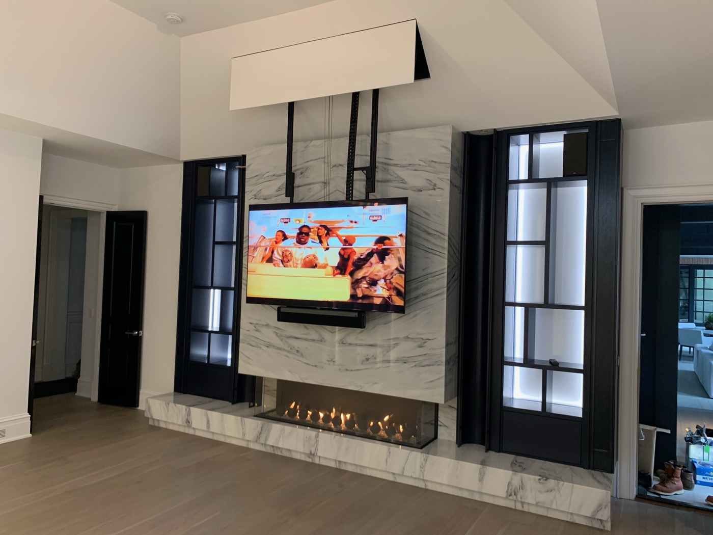 Built-in wall with fireplace and television