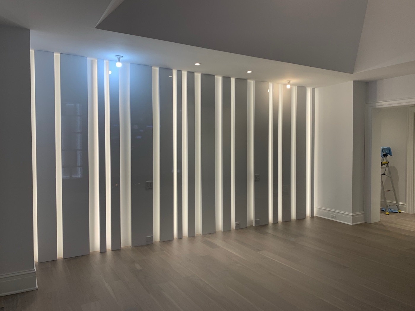 Backlit vertical slat feature wall