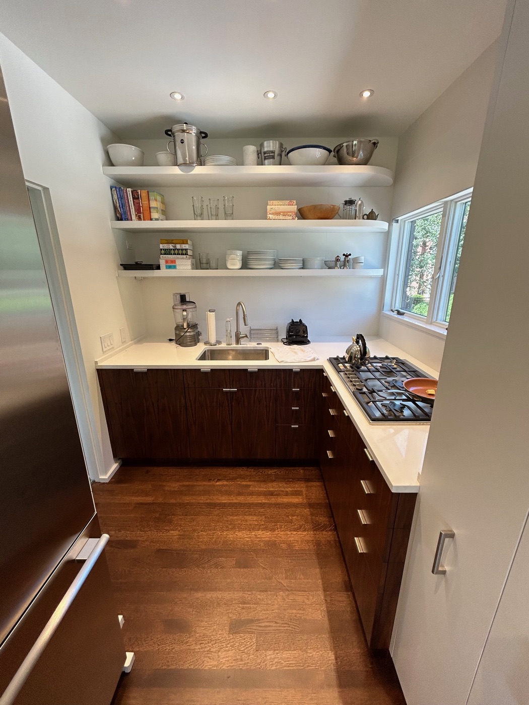White kitchen with dark wood island