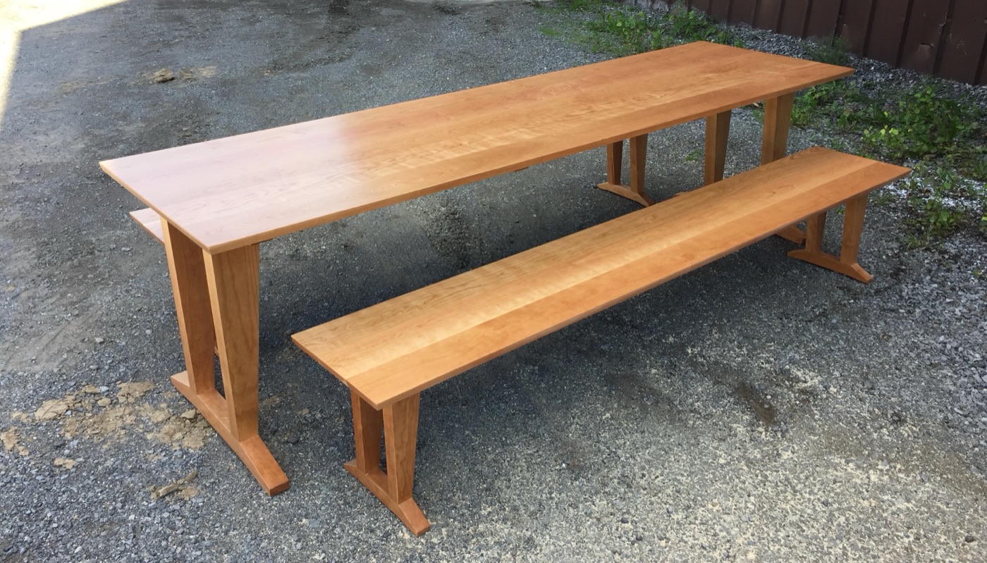 Cherry trestle table and benches, outdoors