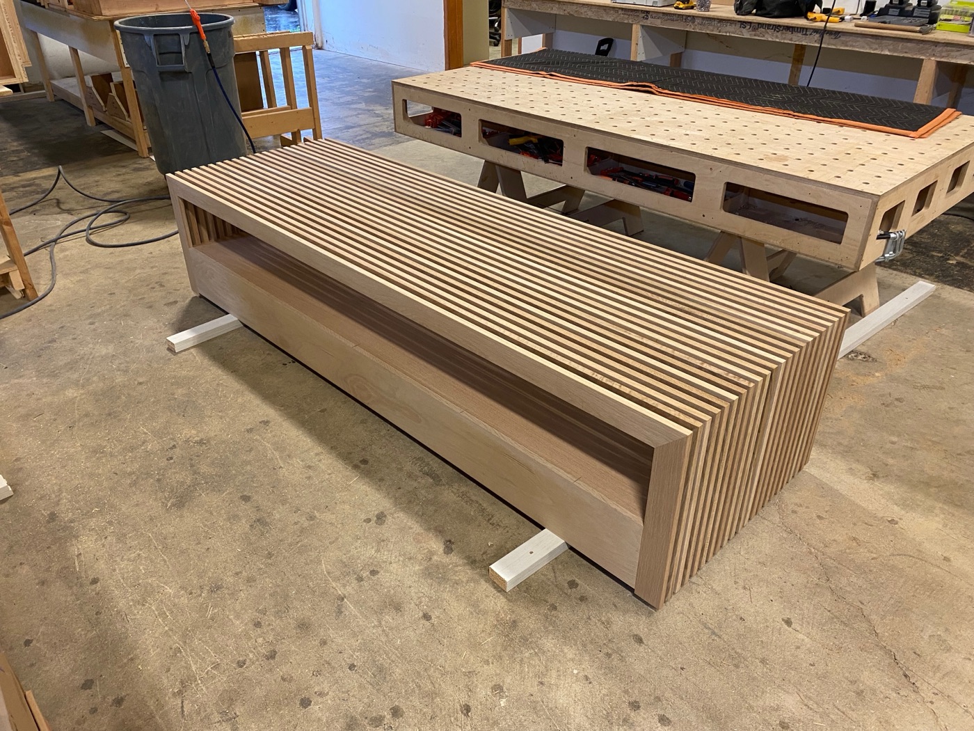 Sculptural ribbed slatted wood bench