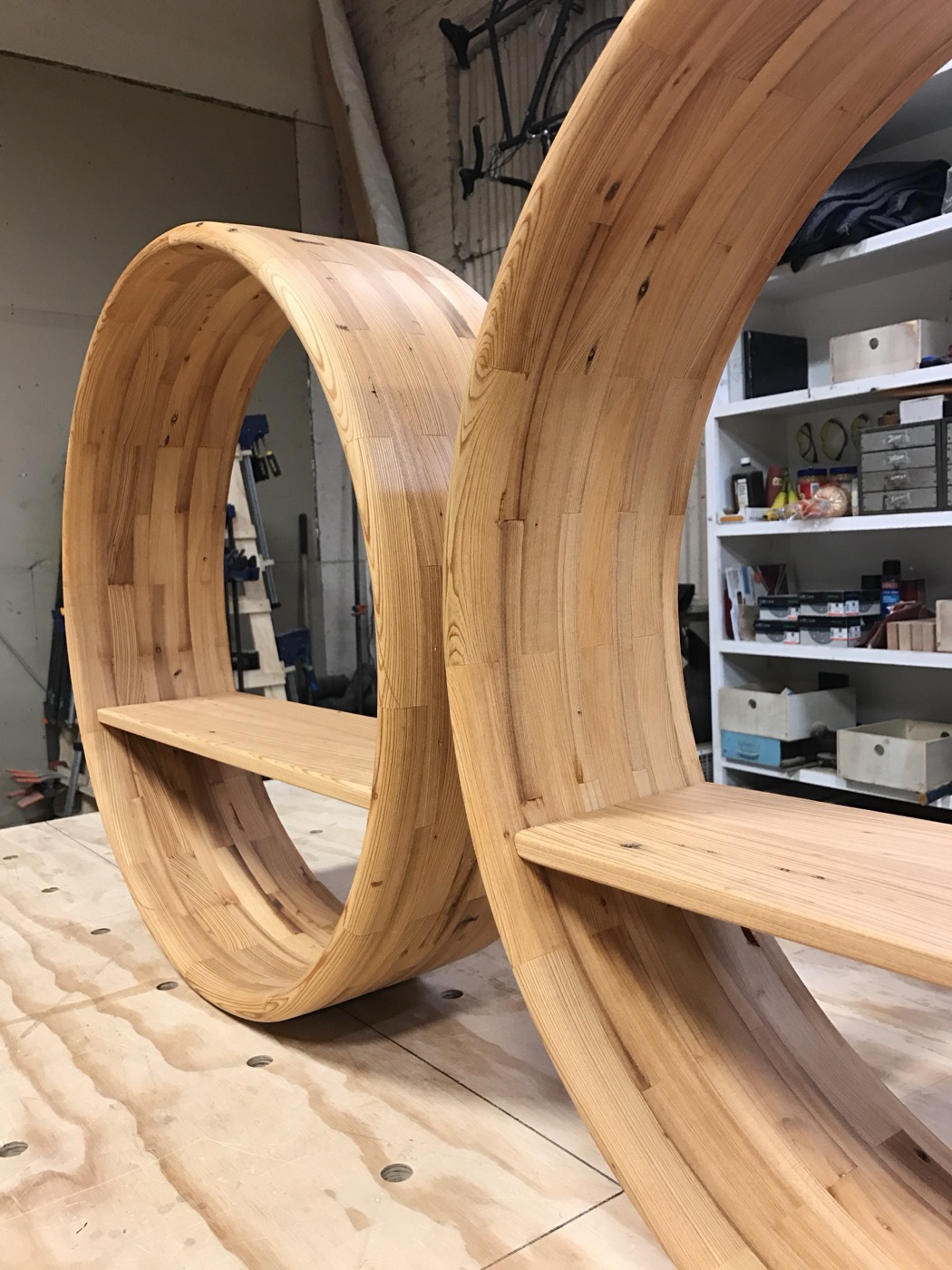 Bent-laminated wood rings being formed
